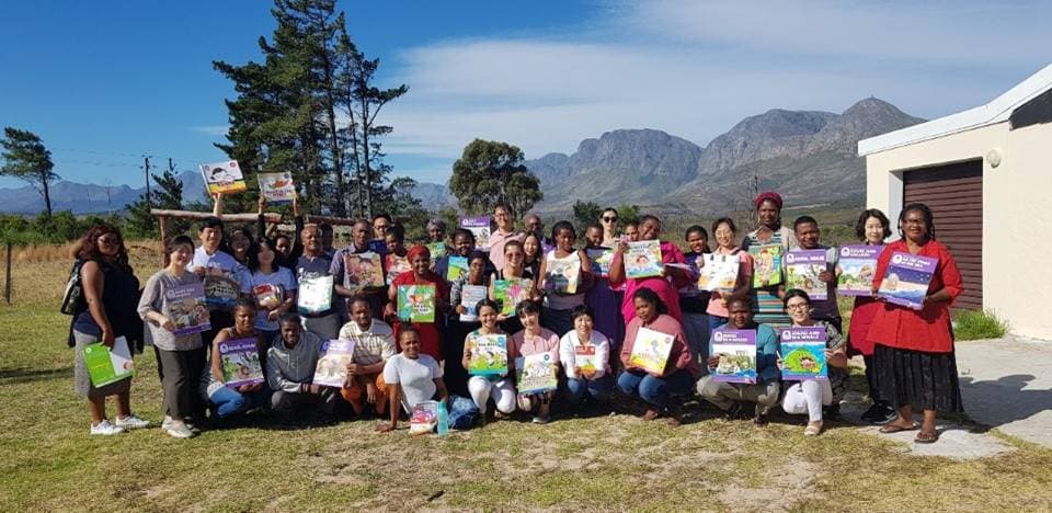 Teachers at a training day holding their Special Me, Hello Me and Weavy class sets